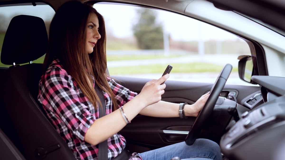 Woman driving while texting MSN.