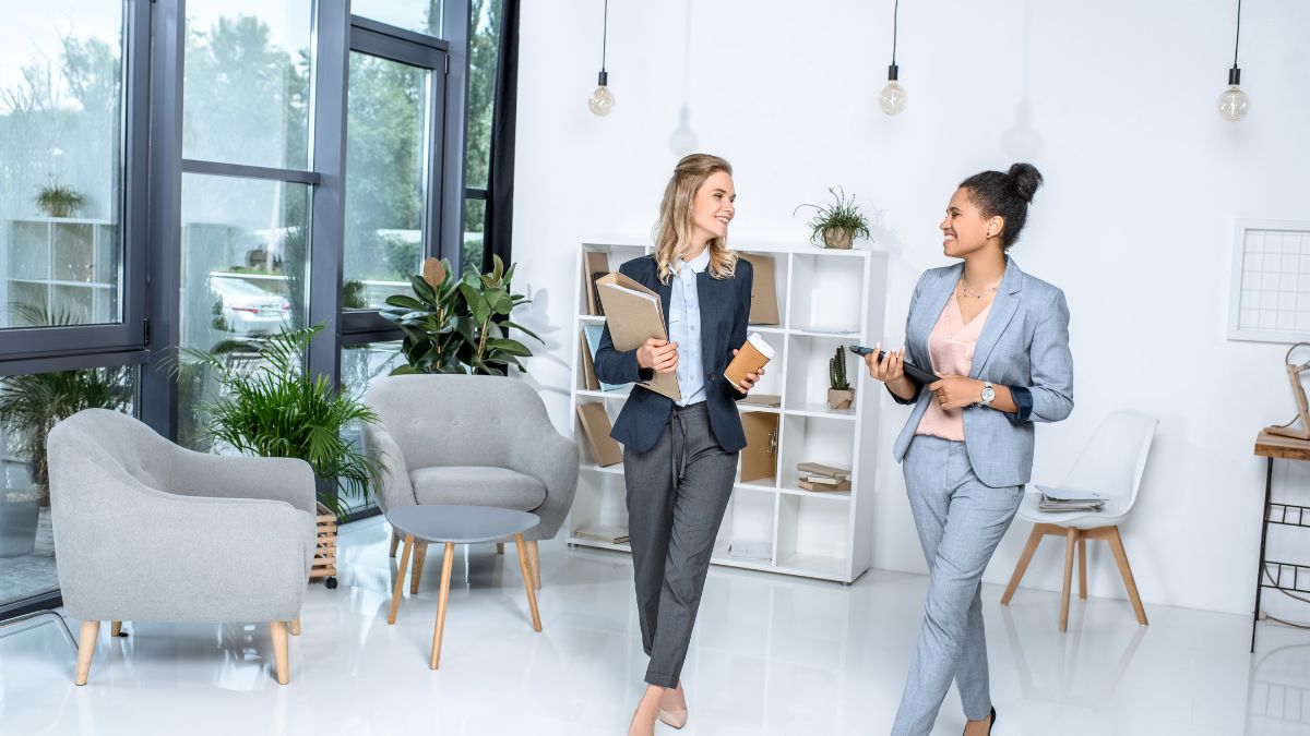 Beautiful bussiness women wlaking while talking about business MSN