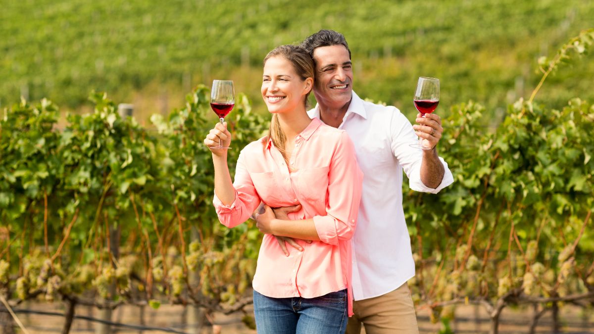 Sweet couple drinking wine in a vineyard MSN