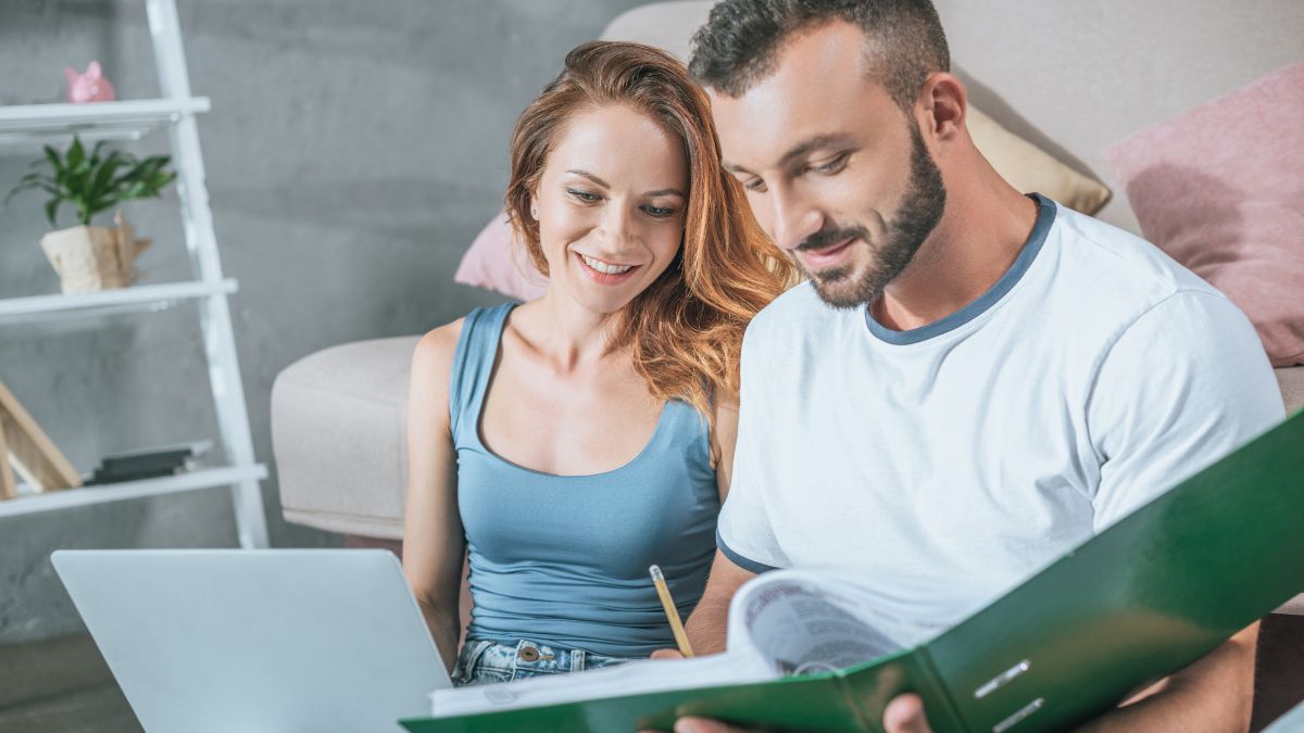 Couple happily doing financial planning for the long term MSN
