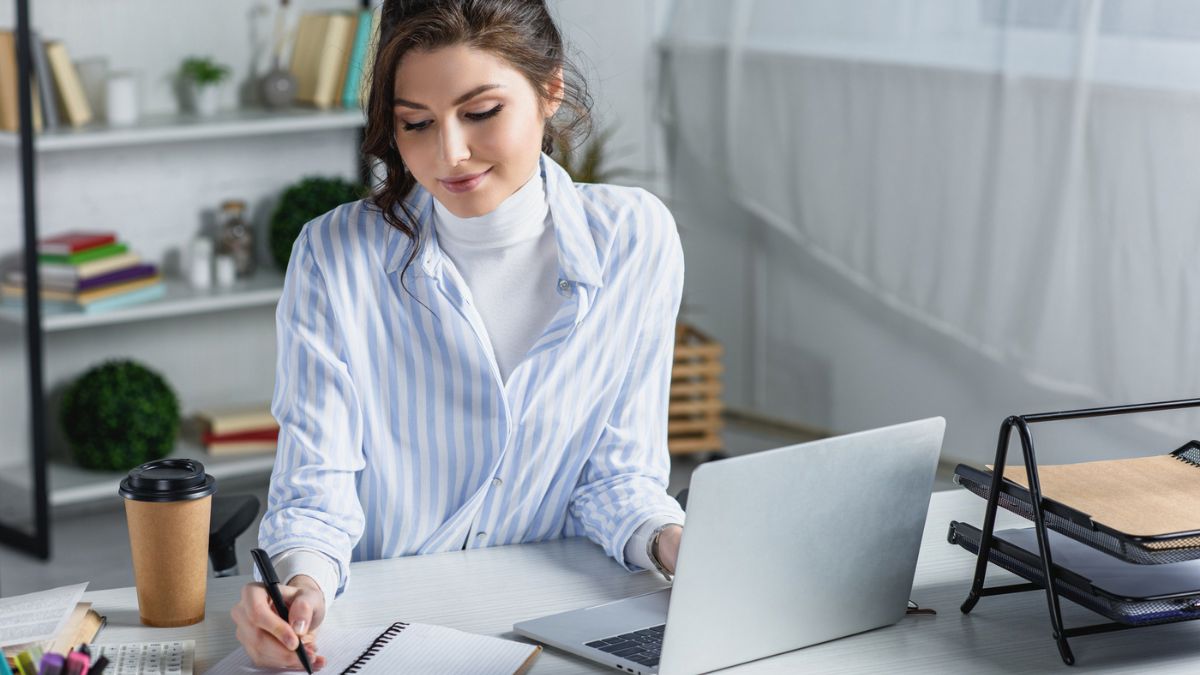 Beautiful woman writing her thoughts MSN