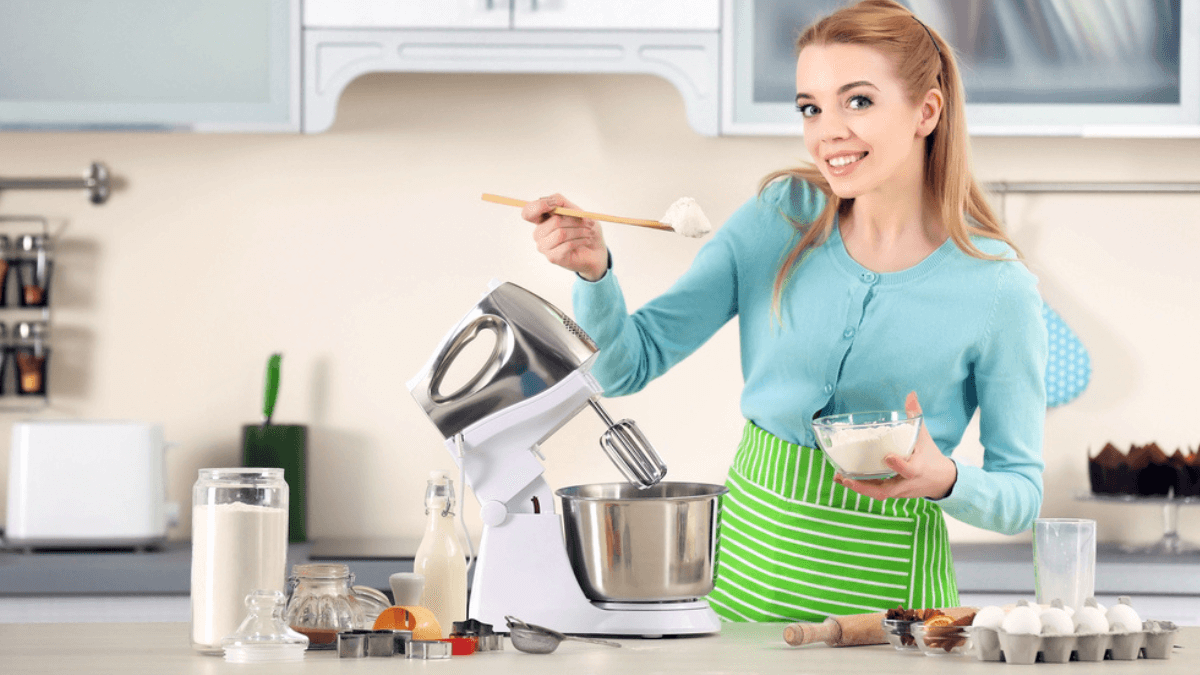 Woman adding flour to the mixer MSN