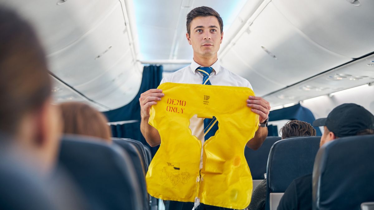 Flight attendant explaining airplane rules MSN