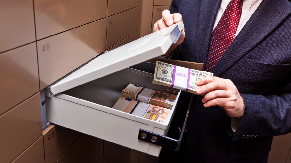Man holding a locker in a bank vault MSN