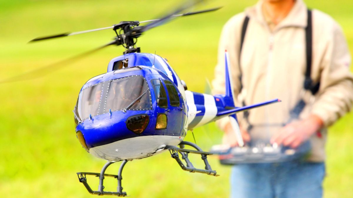 Man playing with a toy helicopter MSN