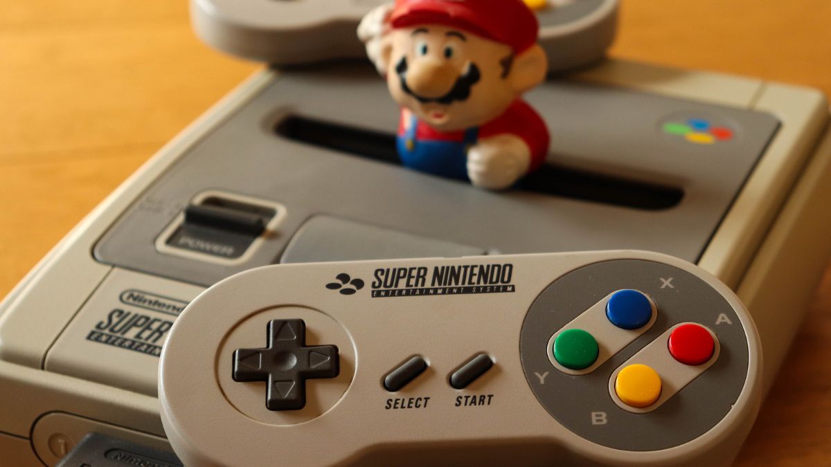 Super NES Console with Super Mario figure MSN