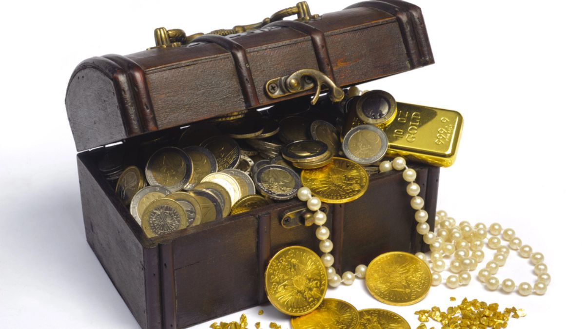 Treasure chest filled with gold coins, bars, and pearls MSN