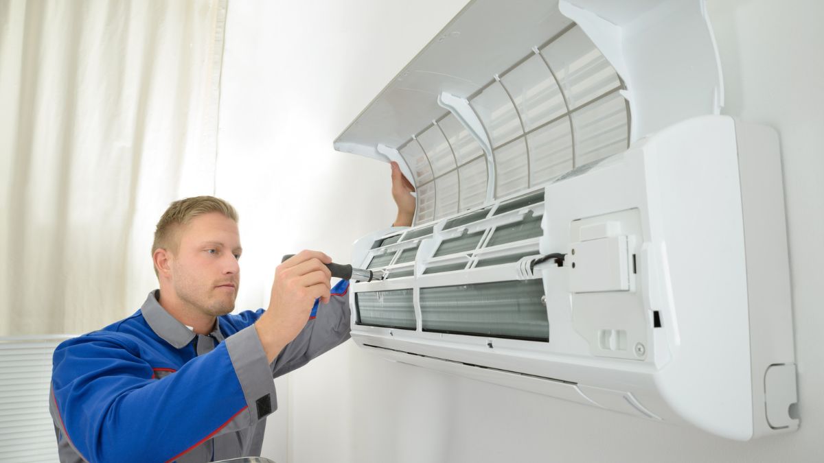 Young man repairing the air conditioner MSN