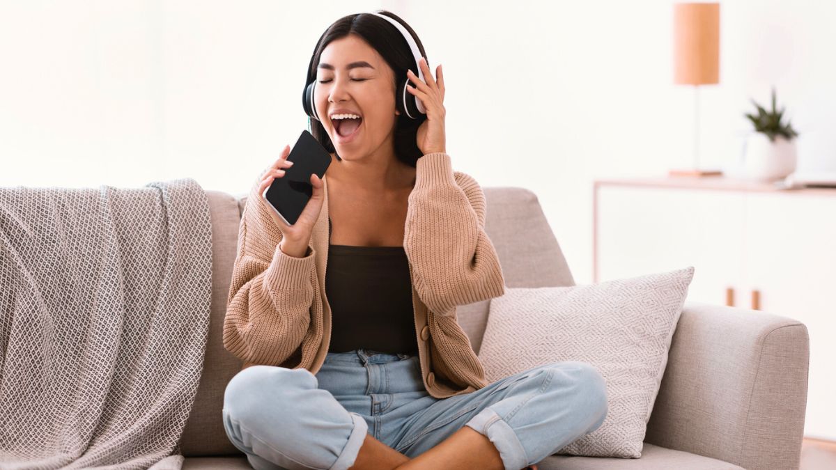 Happy Asian Lady Singing Using Smartphone as Mic MSN