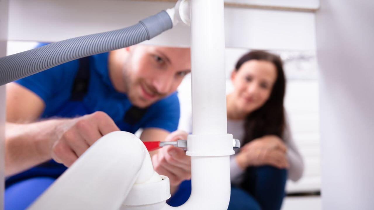 Male Fixing PVC Pipes in the Kitchen MSN