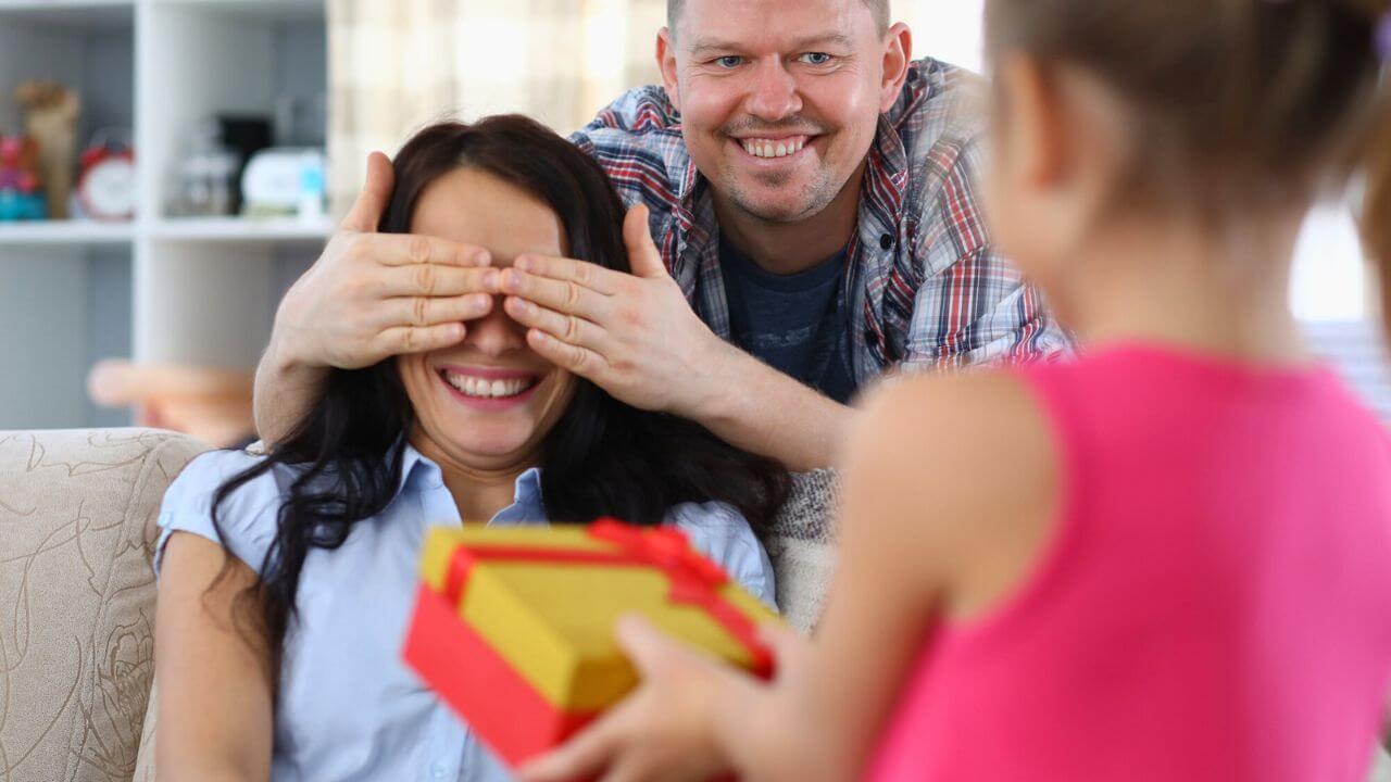 Daughter Giving Gift To Mom