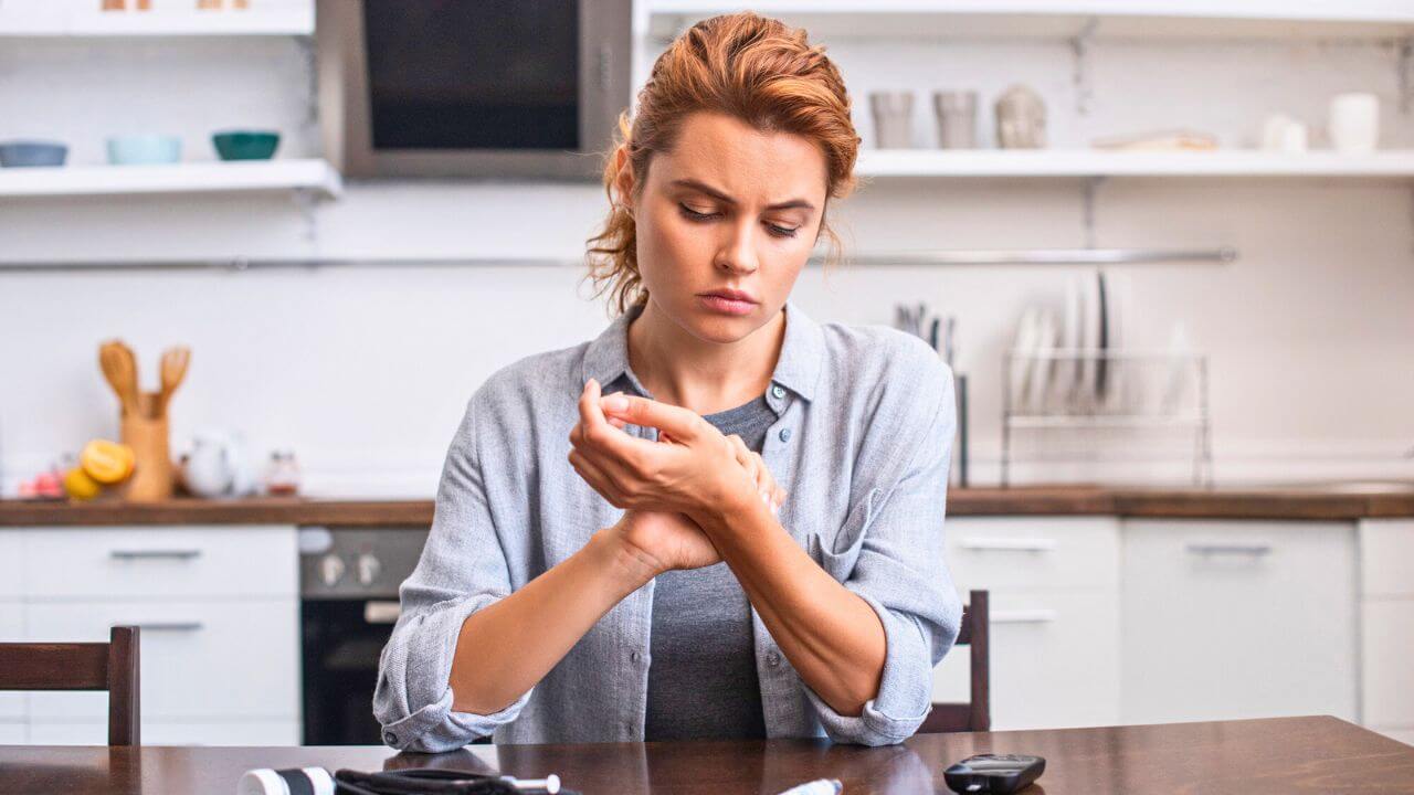 Attractive Woman Scratching Hand