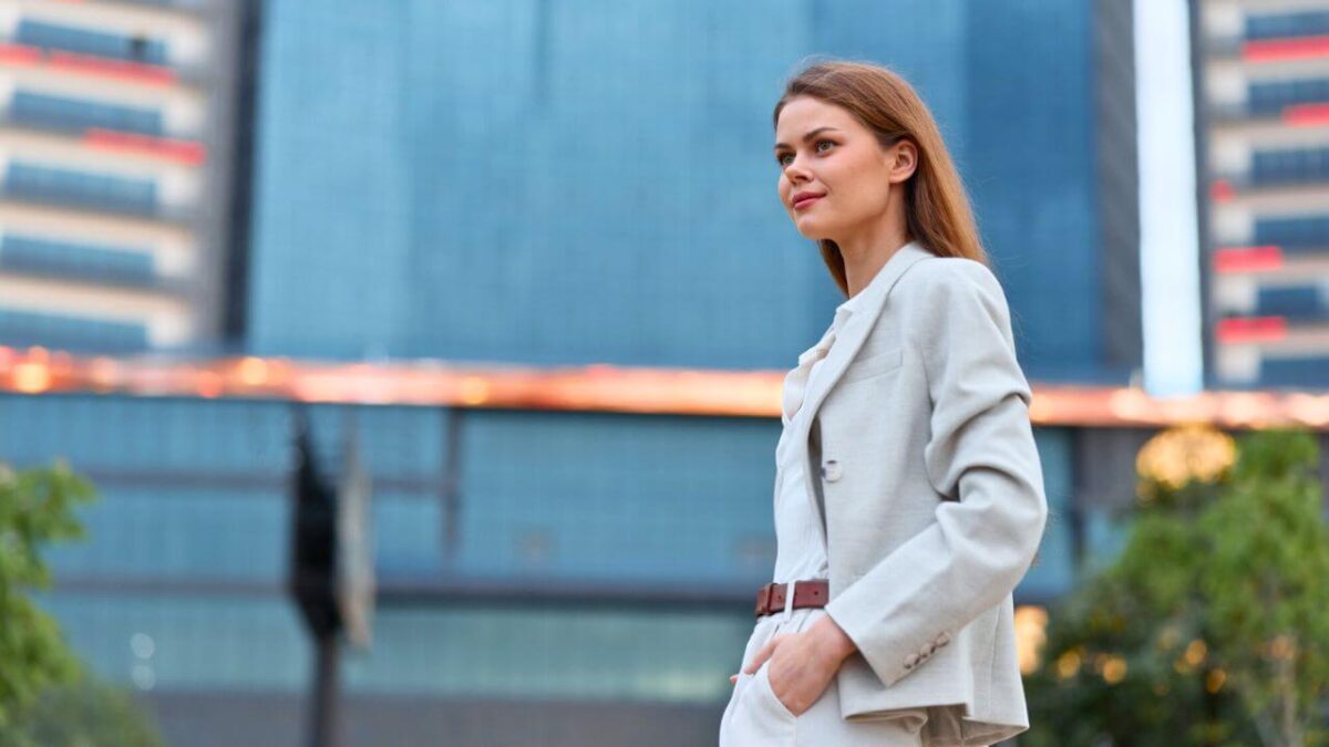 Confident Woman in Business Attire Standing Outdoors